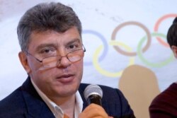 FILE - Boris Nemtsov, a former Russian deputy prime minister and opposition leader, presents a report claiming widespread corruption during preparations for the 2014 Winter Games in Sochi, at a news conference in Moscow, May 30, 2013.