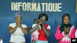 Christian and Muslim supporters of Alassane Ouattara participate in a special Muslim prayer in honor of the civilians killed in three months of post-election violence, following Friday prayers at a mosque in the Treichville neighborhood of Abidjan, Ivory