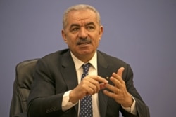 Palestinian Prime Minister Mohammad Shtayyeh addresses journalists during a meeting with members of the Foreign Press Association in Ramallah, in the Israeli-occupied West Bank, June 9, 2020.