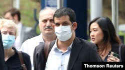 Al Jazeera senior producer Drew Ambrose leaves Bukit Man police headquarters after being questioned by the Malaysian police over a documentary on the country’s arrests of undocumented migrants, in Kuala Lumpur, Aug. 4, 2020.