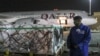 The first arrival of COVID-19 vaccines to Kenya is offloaded from a Qatar Airways flight at Jomo Kenyatta International Airport in Nairobi, Kenya, March 3, 2021.