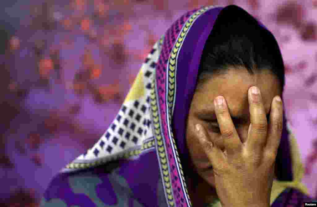 A survivor of slavery who wished to remain anonymous poses for a picture in New Delhi, India.
