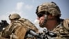 Tentara Amerika meninggalkan Bandara Internasional Hamid Karzai di Kabul, Afganistan pada Senin (30/8). (Foto: Reuters)
