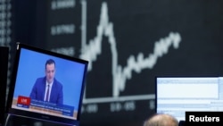 A television broadcast shows German Health Minister Jens Spahn during a trading session at the Frankfurt stock exchange, amid the coronavirus disease (COVID-19) outbreak, in Frankfurt, Germany, Dec. 30, 2020. 