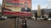 FILE - A billboard shows Chinese President Xi Jinping with the slogan "To exactly solve the problem of corruption, we must hit both flies and tigers," in Gujiao, in northern China's Shanxi province, Feb. 6, 2015.