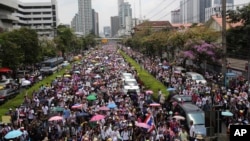 Thai anti-government protesters march on the street during a mass rally in Bangkok, Thailand, Mar. 29, 2014. 