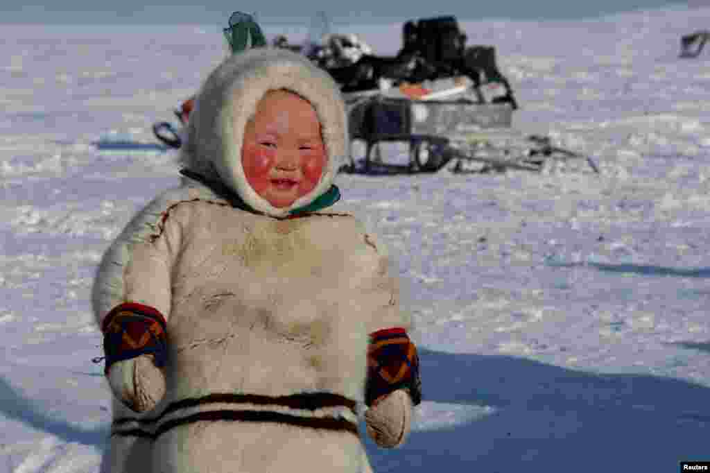 A child from the indigenous community "Yamb To" (Long Lake) is seen at a reindeer camping ground, about 450 km northeast of Naryan-Mar, in Nenets Autonomous District, Russia.