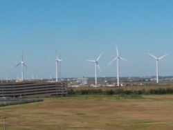 FILE - Windmills are seen at a utility plant in Atlantic City, New Jersey, Oct. 1, 2020.