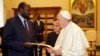 Pope Francis exchanges gifts with South Sudan President Salva Kiir during a private audience at the Vatican, March 16, 2019.