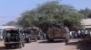 FILE - Kenya Defense Forces soldiers arrive at the scene of a bomb attack claimed by al-Shabab militants in the northeastern town of Mandera, northern Kenya, Oct. 25, 2016.