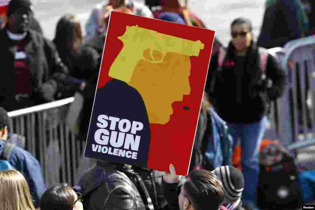 Participants hold up signs as students and gun control advocates hold the "March for Our Lives" event demanding gun control after recent school shootings at a rally in Washington, U.S., March 24, 2018. (REUTERS/Aaron P. Bernstein)
