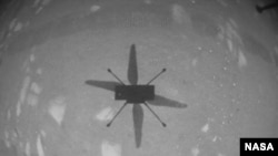 NASA’s Ingenuity Mars Helicopter captured this shot as it hovered over the Martian surface on April 19, 2021, during the first instance of powered, controlled flight on another planet.