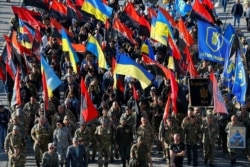 Activists and supporters of Ukraine's nationalist movements take part in a rally in Kyiv, Ukraine, Oct. 14, 2019.