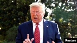 President Donald Trump responds to a reporter's questions as he departs to Texas from the White House, Washington, D.C., Sept.22, 2019. 