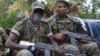 Republican forces troops allied with President Alassane Ouattara drive through the village of Keibly, just outside Blolequin in western Ivory Coast, May 31, 2011.