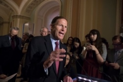 FILE - Sen. Richard Blumenthal, D-Conn., responds to questions from reporters.