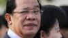 FILE - Cambodian Prime Minister Hun Sen (L) at Koh Pich island in Phnom Penh