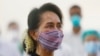 FILE - Myanmar leader Aung San Suu Kyi watches the vaccination of health workers at a hospital in Naypyitaw, Jan. 27, 2021.