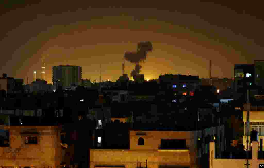 Smoke rises after an Israeli missile strike in Beit Lahia, northern Gaza Strip, July 7, 2014.