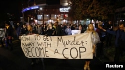 Protesters march through uptown Charlotte, North Carolina following the decision of the district attorney not to press criminal charges against police in the shooting of Keith Scott, Nov. 30, 2016.