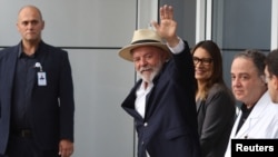 Brazil's President Luiz Inacio Lula da Silva, waves while leaves the Sirio-Libanes Hospital after a surgery, in Sao Paulo, Dec. 15, 2024. 
