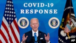 In the March 10, 2020, photo, President Joe Biden speaks in the South Court Auditorium in the Eisenhower Executive Office Building on the White House Campus in Washington.