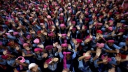 School girls wearing pink turban wave during celebrations to mark International Day of the Girl Child 2018, at a school in Chandigarh, India October 11, 2018.