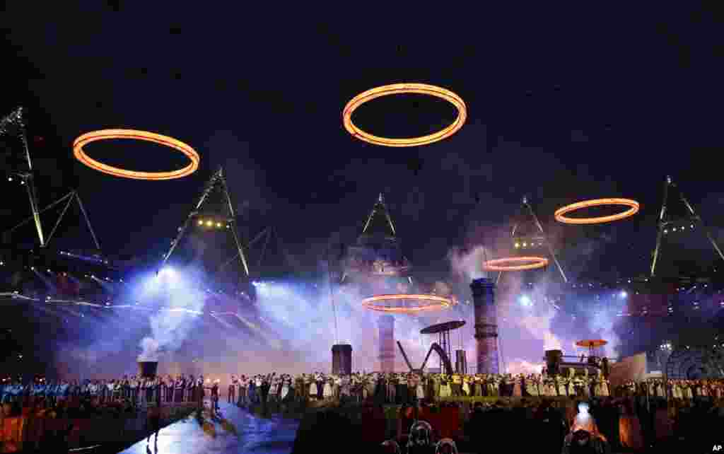The Olympic rings are illuminated during the Opening Ceremony at the 2012 Summer Olympics, July 27, 2012, in London.