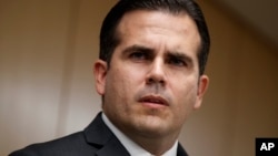 FILE - In this Nov. 13, 2017, photo, Puerto Rico Gov. Ricardo Rossello speaks during a news conference, in Washington. Rossello said on Jan. 22, 2018, that he is privatizing the island’s government-owned power company following decades of mismanagement, corruption and blackouts. 