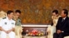 Captain Wang Hong Li (L), Commanding Officer of the 23rd Chinese Naval Escort Task Force, smiles as Cambodia's Defense Minister Tea Banh (R) speaks during a meeting at the Ministry of National Defense of Cambodia, in Phnom Penh, Cambodia October 17, 2016.