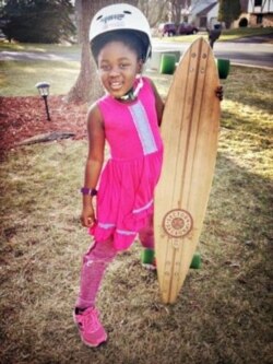 Monique Pederson poses with her skateboard. (Courtesy - Steve Pederson)