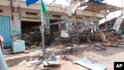 FILE - The wreckage of a bus remains at the site of an airstrike in Saada, Yemen, Aug. 10, 2018. 