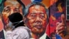 Seorang wanita melewati mural yang menggambarkan Perdana Menteri Malaysia Muhyiddin Yassin di Kuala Lumpur, Malaysia, 27 Oktober 2020. (Foto: REUTERS/Lim Huey Teng)