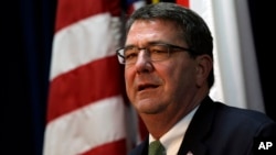 FILE - U.S. Deputy Secretary of Defense Ashton Carter answers reporter's question during a news conference at the U.S. Embassy in Seoul, South Korea, March 18, 2013.