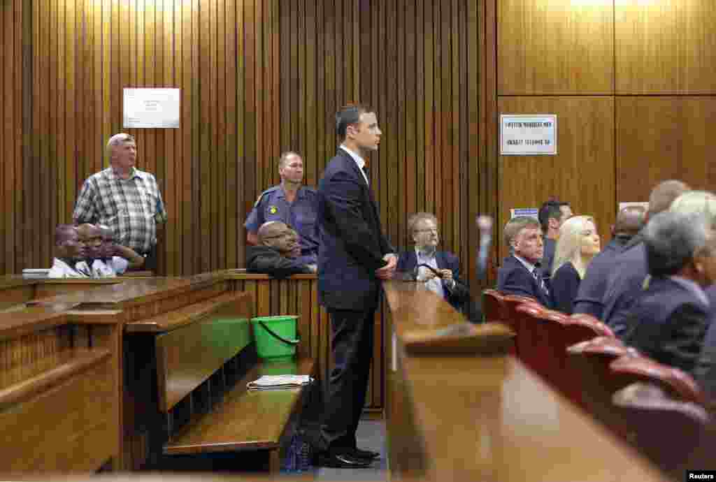 Oscar Pistorius stands in the dock at the North Gauteng High Court in Pretoria, Sept. 11, 2014. 