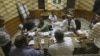 Egyptian elections officials count ballots at a polling center during the second day of the presidential runoff, in Cairo, Egypt, Sunday, June 17, 2012.