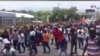 Protesters march pastUS Embassy in Port au Prince, Haiti, July 29, 2019. (VOA/S. Lemaire)