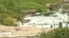Children bath and swim in a river as people turn to unprotected sources of water in Harare, Zimbabwe, March 7, 2019. 
