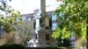 A student reads a book on campus, at Ohio University. 