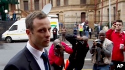 Oscar Pistorius arrives at the high court in Pretoria, South Africa, March 12, 2014.