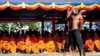 Cambodian students re-enact torture executed by the Khmer Rouge to mark the annual "Day of Anger" at Choeung Ek, 20 May 2010