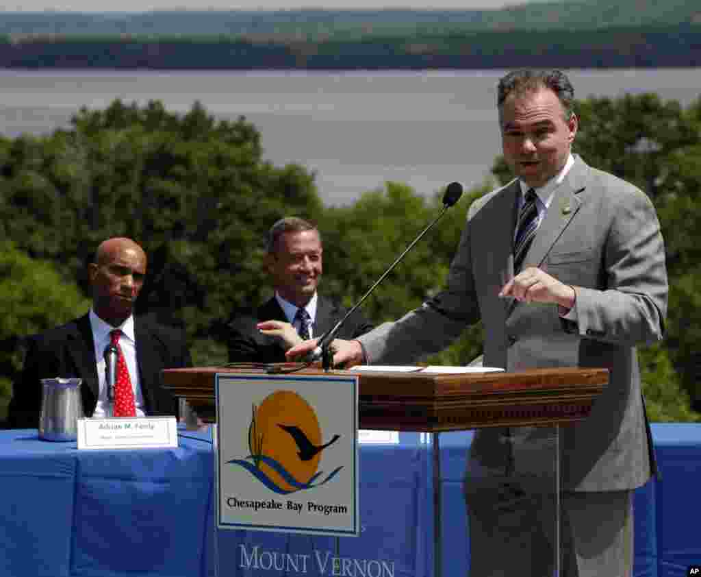 With the Potomac River in the background, District of Columbia Mayor Adrian Fenty, left, and Maryland Gov. Martin O'Malley, center, listen to Virginia Gov. Time Kaine, right, speak at a news conference about proposed cleanup measures for the Chesapeake Bay watershed, at the Mount Vernon Estate in Mt. Vernon, Virginia, May 12, 2009.