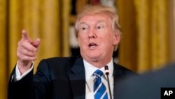 President Donald Trump speaks in the East Room of the White House in Washington during a meeting with House Republicans about a proposed health bill, March 7, 2017.