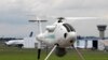 မှတ်တမ်းဓာတ်ပုံ - Schiebel ရဲ့ Camcopter ကို ၄၈ ကြိမ်မြောက် ပါရီ Air Show မှာ တွေ့ရစဉ်။ ( ဇွန်လ ၁၈, ၂၀၀၉ -REUTERS/Pascal Rossignol (FRANCE TRANSPORT BUSINESS) 