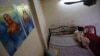A Pakistani asylum seeker, photographed in January, hides in a small apartment on Bangkok’s edge. Lacking legal status, refugees scrape by while awaiting resettlement. Some have been caught up in Thailand's efforts to curb human trafficking.