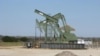 FILE - A pump jack stands in Dewitt County, Texas, January 2016. 