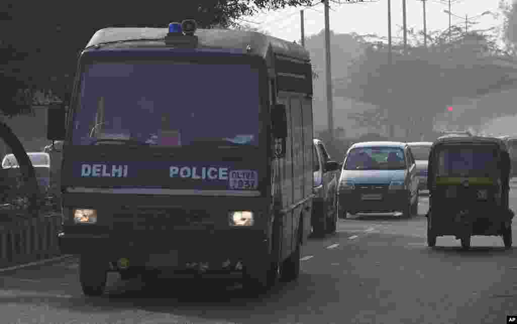 A Delhi state police van believed to be carrying the accused in a gang rape leaves the Saket district court in New Delhi, India, January 7, 2013.