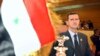 Sirijski predsjednik Bashar Assad gleda u zastavu svoje zemlje na otvaranju 16. redovnog zasjedanja arapskog samita u Tunisu, Tunis, 22. maja 2004.