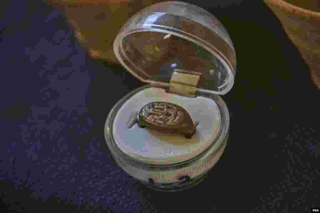 The Egyptian excavation team found a silver ring for Amenhotep III decorated with a scarab. (H. Elrasam/VOA)