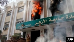 A man stands outside a faculty building at Cairo's Al-Azhar University, December 28, 2013.